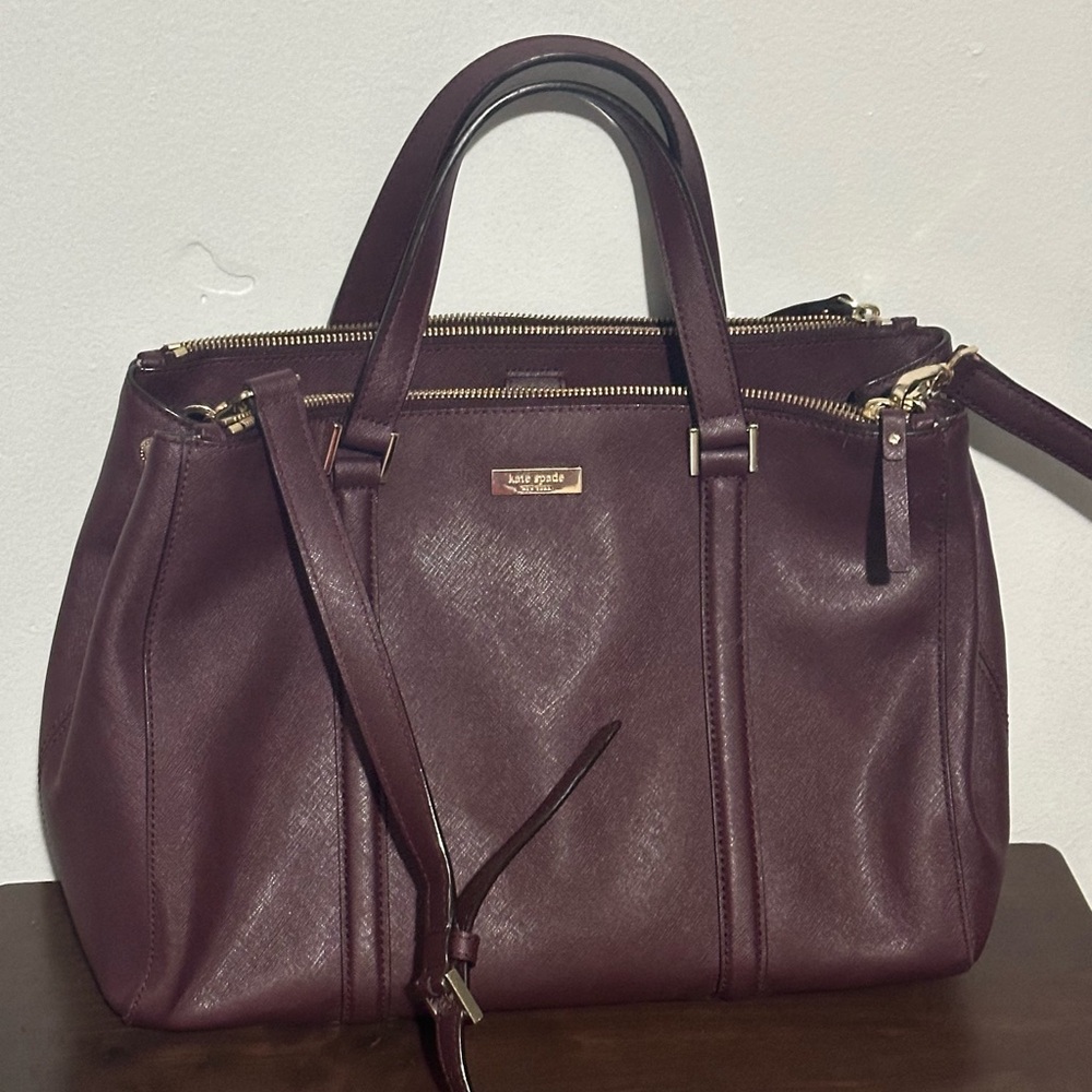 Maroon Kate Spade bag with cross body strap